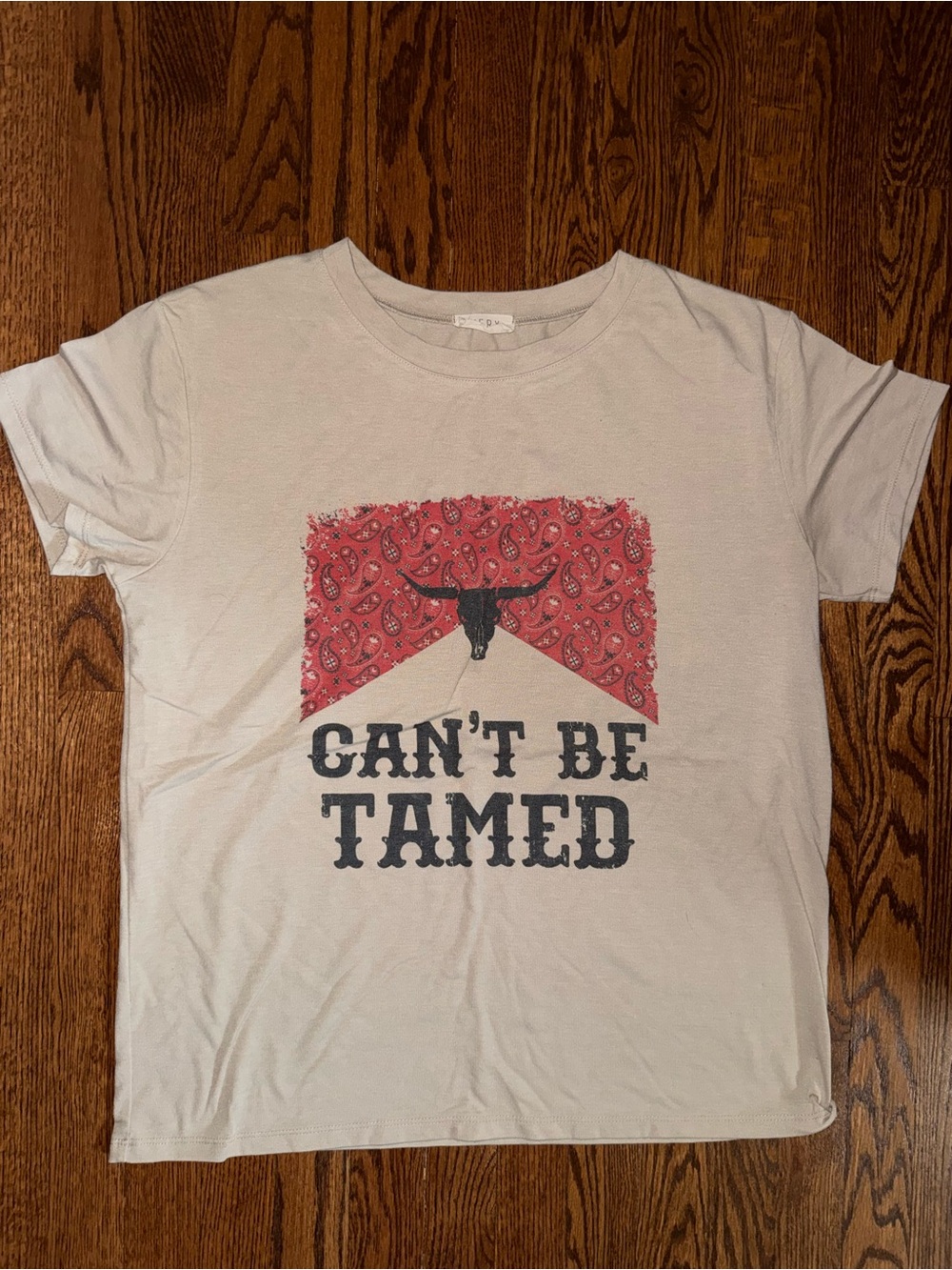 Avery White Tee with Red Bandana Graphic - "Can't Be Tamed"